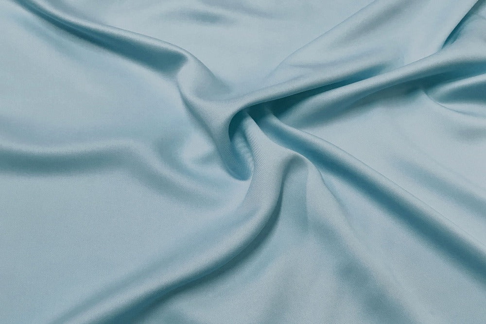 Close up view of silky smooth sky color bamboo bedsheets fabric
