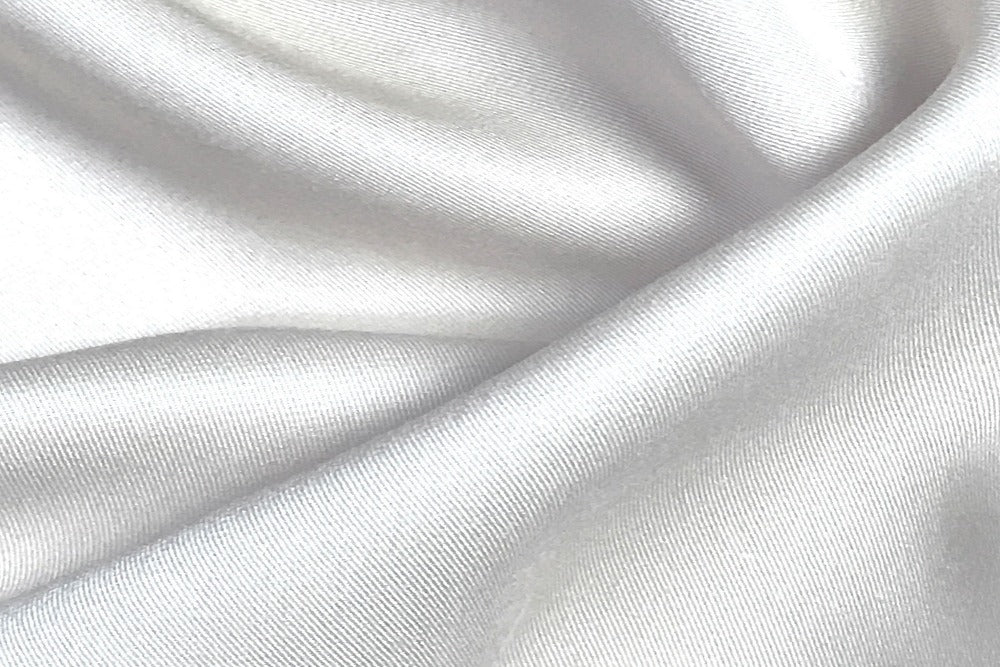 Close up view of silky smooth white color bamboo bedsheets fabric