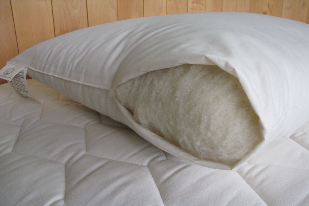 https://www.riverpineoutlet.com/cdn/shop/products/premium-eco-wool-bed-pillow-fill.jpg?v=1676925849&width=1445